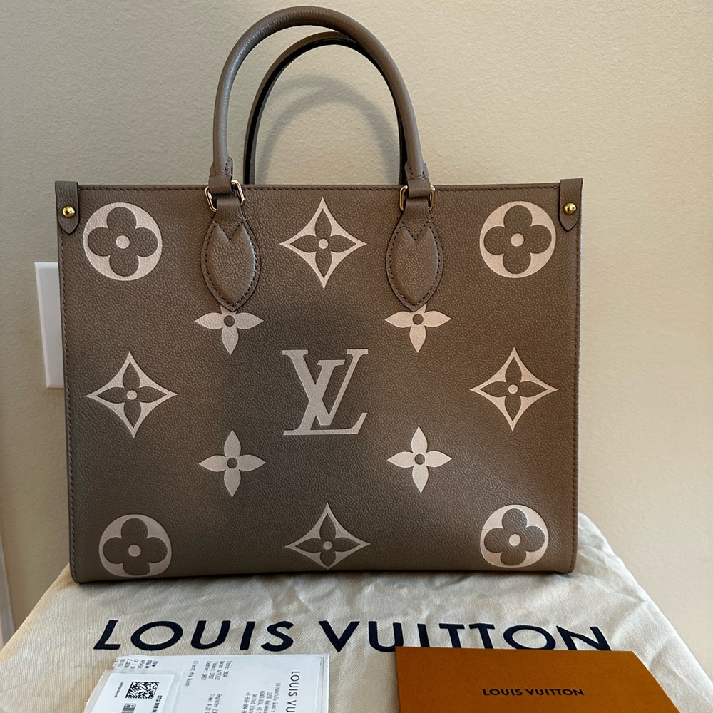 Authentic Louis Vuitton On The Go MM Bicolor Monogram Empreinte Leather